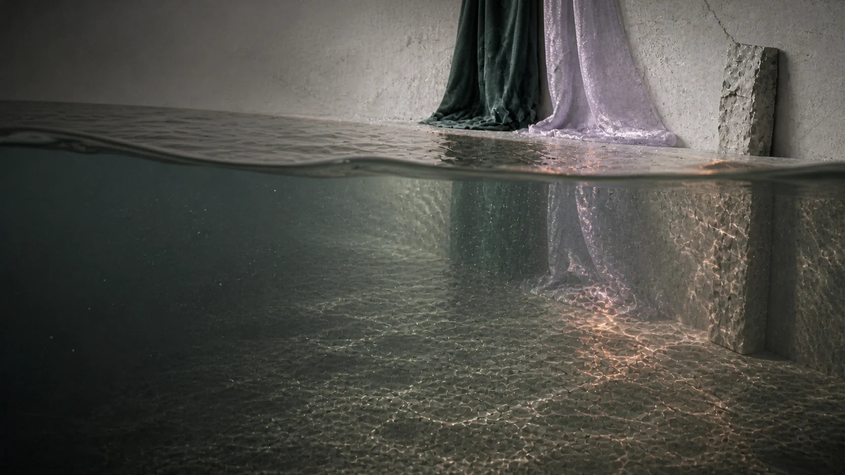 A continuous view crossing the water surface into the quieter layer beneath